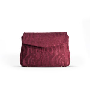 Front view of the Dark Cherry crossbody bag in bordeaux moiré jacquard.