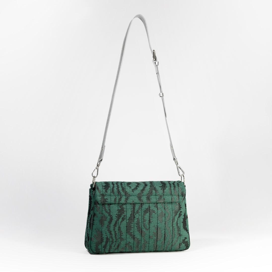 Back view of the Jade Melon crossbody bag in green moiré jacquard with clean stitching.