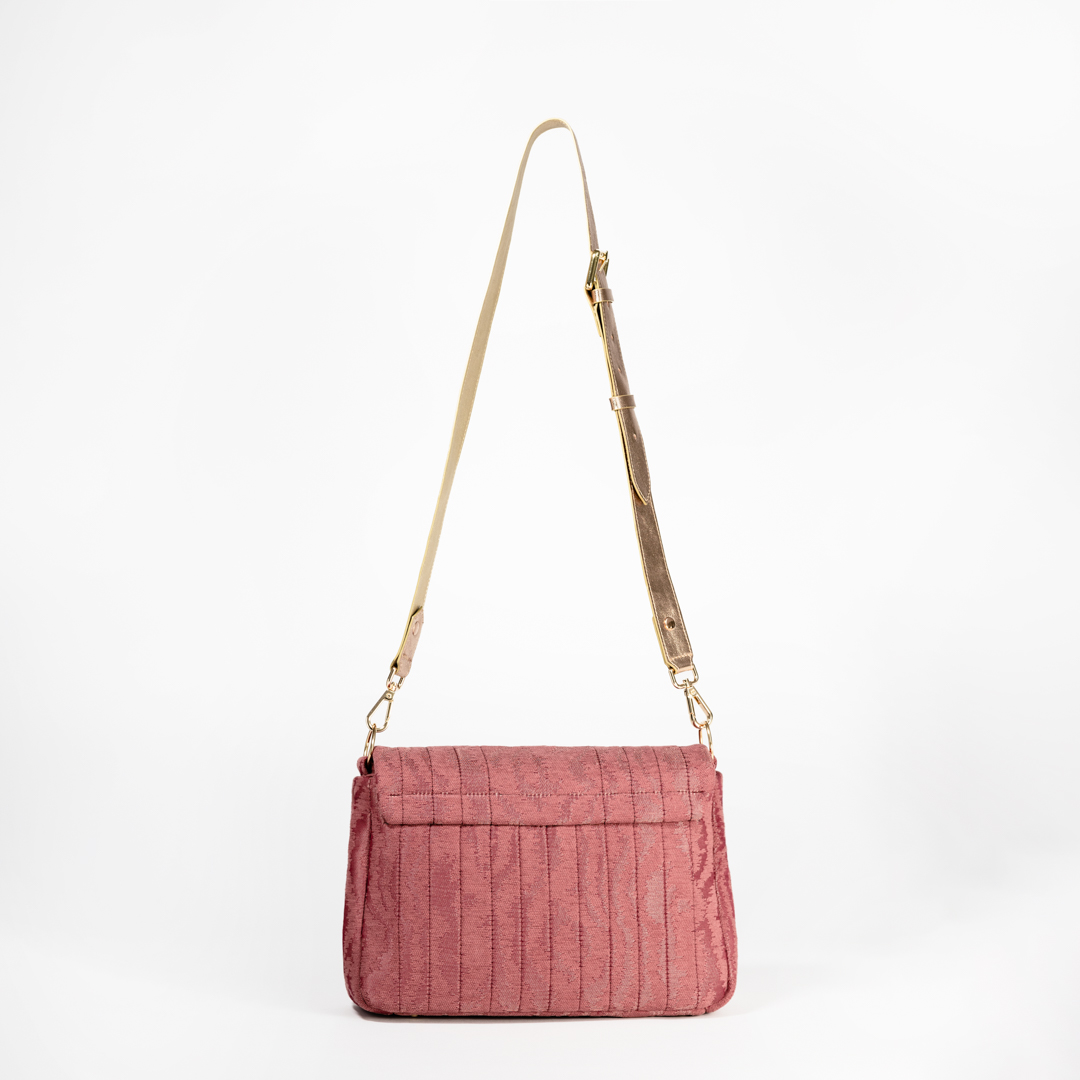Back view of the Ballet Blush crossbody bag in pink moiré jacquard fabric.