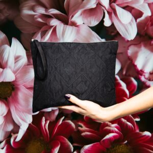 Black quilted matelassé zip pouch with satin lining and wrist loop